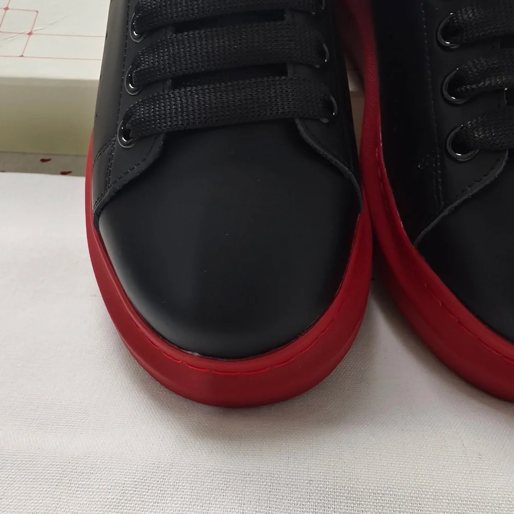 Alexander McQueen Black Leather Sneakers with Red Soles
